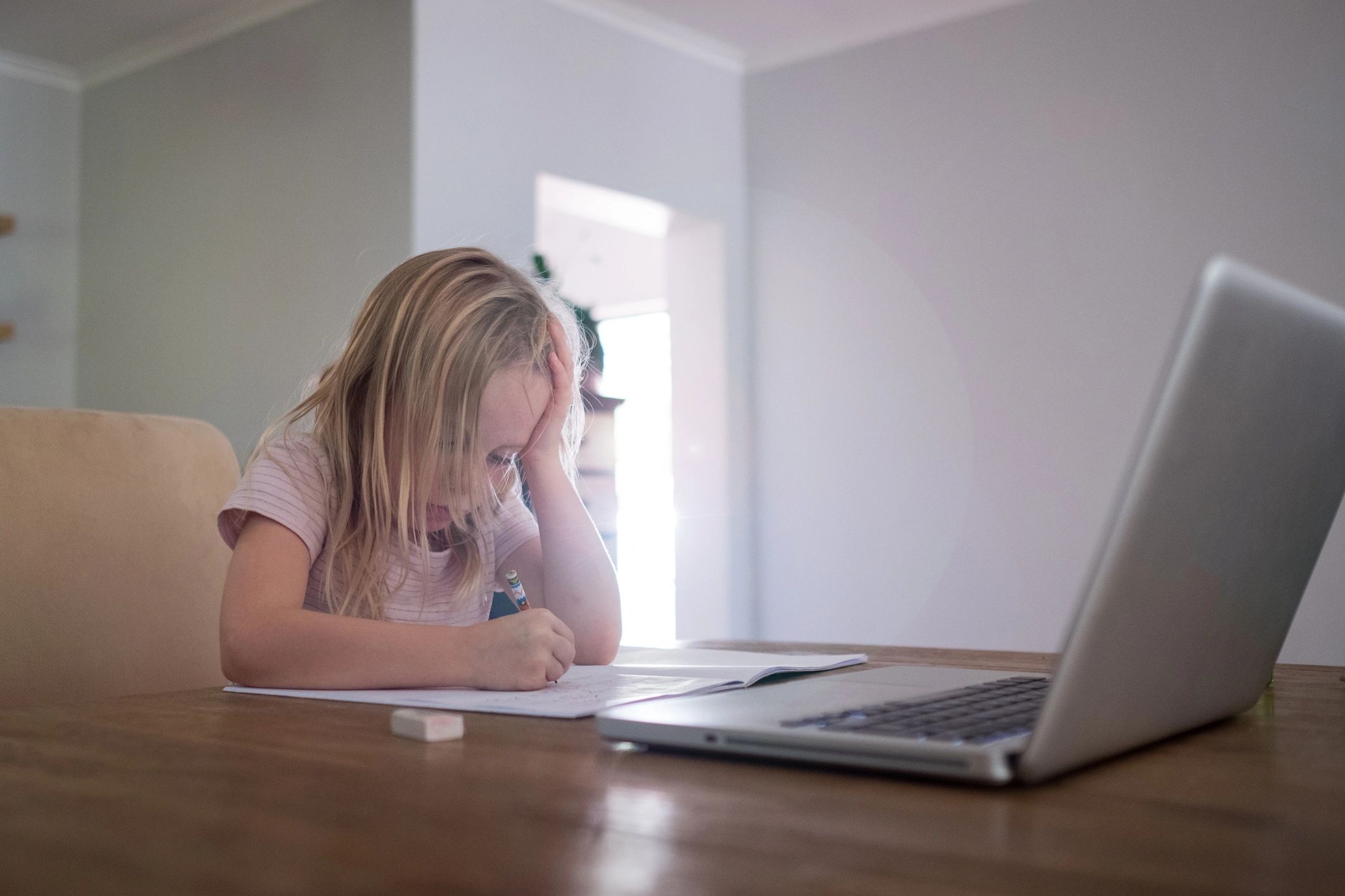 Learner practicing writing at home