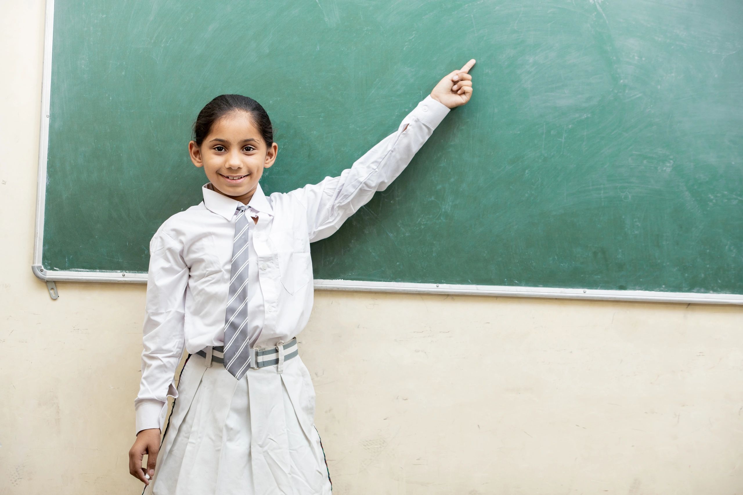 Smiling schoolgirl in a classroom
